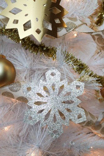 DIY Gold Foil and Glittery Snowflake Ornaments: Add some thrifty sparkle to your Christmas tree with these simple Gold Foil and Glittery Snowflake Ornaments! #christmas #christmasdecorating #christmastree #christmasdecor #snowflake #snowflakepattern